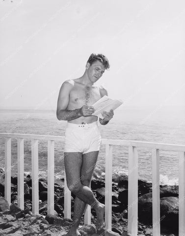 shirtless Burt Lancaster reading a script at the beach 8b20-7164