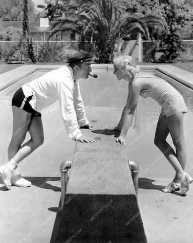 Bing Crosby and wife maybe out by the pool 8b20-7205