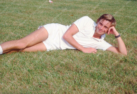 Christopher Atkins laying in the grass 8b20-7584