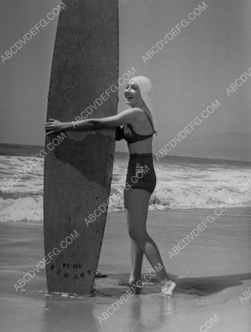 athletic Claudette Colbert in swimsuit with giant surfboard 8b20-7742