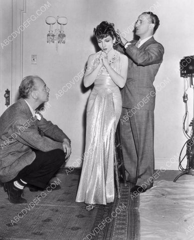 candid Claudette Colbert gets makeup and wardrobe adjustment 8b20-7747