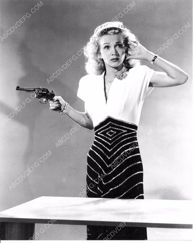 Carole Landis plugging her ears for six shooter 8b20-7869