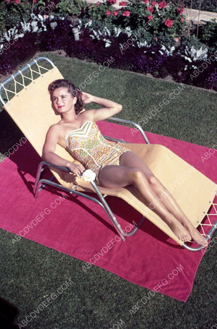 Debbie Reynolds in swimsuit does some sunbathing 8b20-8153