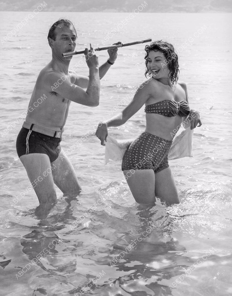 playful and sexy Ava Gardner in the waves w friend and flute 8b20-8505