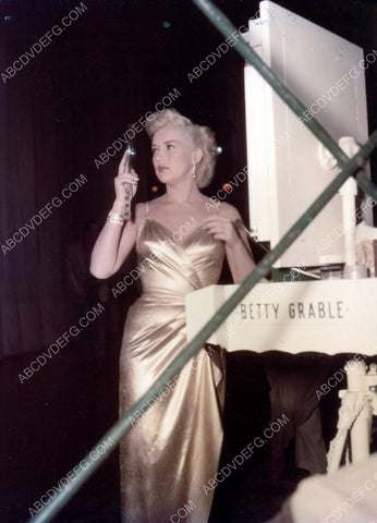 Betty Grable does quick makeup check at her table 8b20-8900