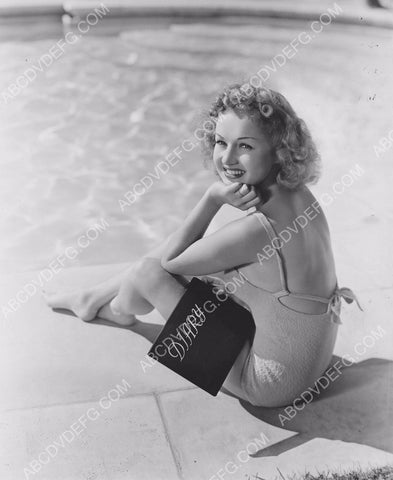 Betty Grable writes in her diary by the swimming pool 8b20-8967