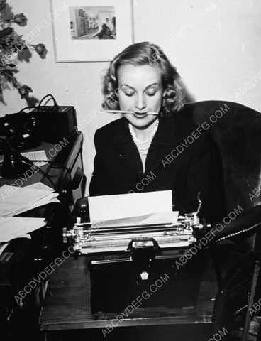 candid Carole Lombard banging away at the typewriter 8b20-9141