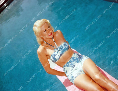 Ginger Rogers in swimwear sitting on the diving board 8b20-9963