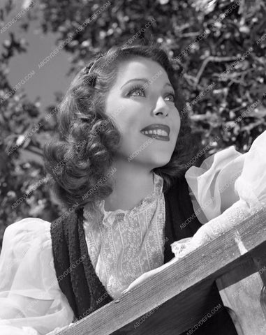 Loretta Young posting by fence medium close up lyoung-20