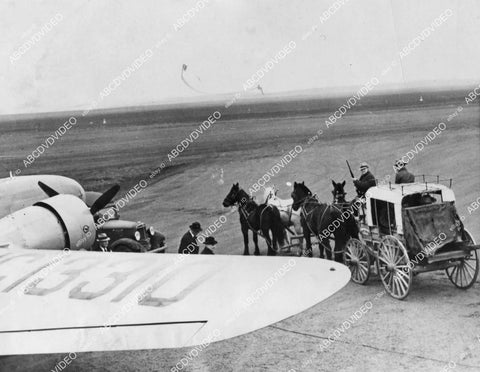 crp-11565 1937 news photo new meets old aviation airmail plane gets trade off from stagecoach mail delivery crp-11565