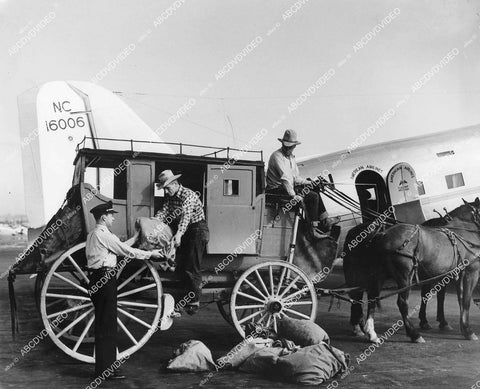 crp-11566 1937 news photo new meets old aviation airmail plane gets trade off from stagecoach mail delivery crp-11566