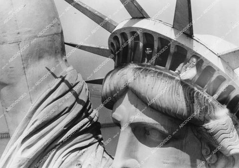 crp-11569 1957 news photo helicopter view of Statue of Liberty crown w visitor waving hello crp-11569