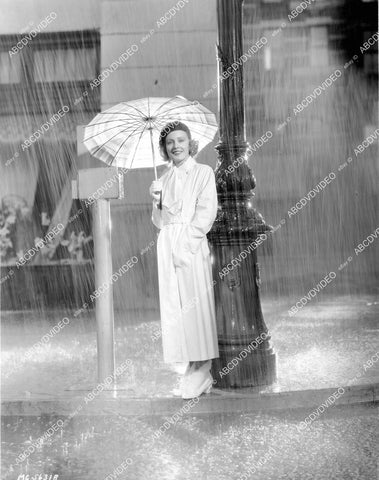crp-11771 1930's Madge Evans standing under umbrella in the rain crp-11771