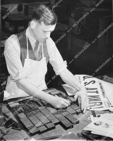 crp-12119 1944 news photo widey read publisher Earl Hays makes newspaper props & document props for movies It Happened Tomorrow crp-12119