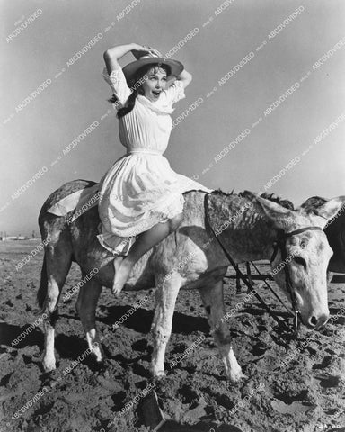 crp-12358 1957 Leslie Caron riding a donkey film Gigi crp-12358