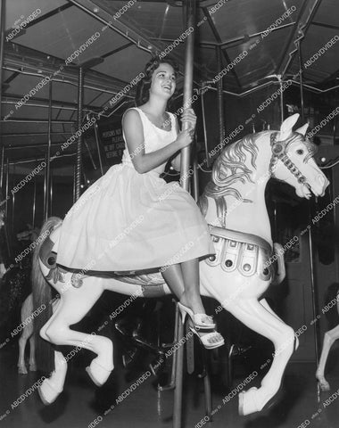 crp-13099 1950's phot some really cute girl riding carousel horse crp-13099