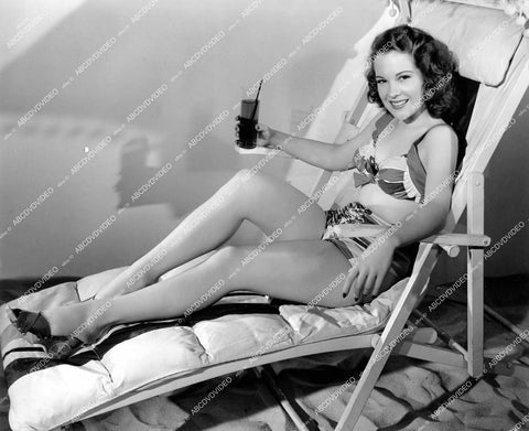 crp-13359 1943 sexy Margaret Landry stretches out legs and has iced tea film The Leopard Man crp-13359