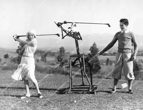 crp-13608 1930 Robert Montgomery, Dorothy Jordan practice golf w vintage swing machine film Love in the Rough crp-13608