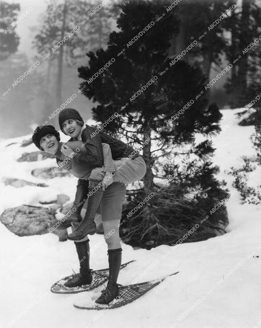 crp-13688 1930's two babes go piggy back in snow shoes (Marion Davies ?) crp-13688