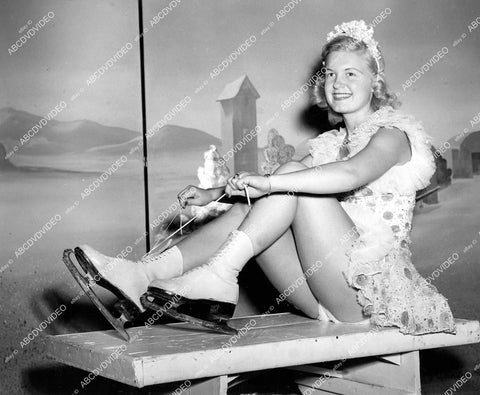 crp-13689 1948 pretty ice skater Joanne Scotvold lacing up her skates Ice Follies of 1949 crp-13689