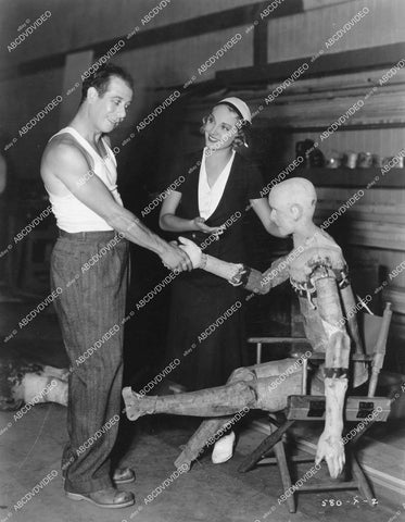 crp-14074 1931 candid Leila Hyams visits Bert Lahr & crash test dummy on set film Flying High crp-14074