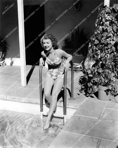 crp-14512 1944 lovely Evelyn Keyes dips her feet in the swimmin pool fim Nine Girls crp-14512