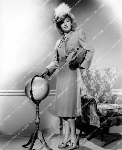 crp-14595 1942 Evelyn Keyes in new fashion standing at a globe crp-14595