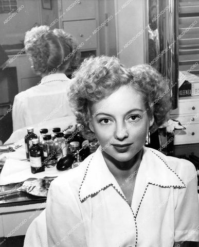 crp-14610 1943 Evelyn Keyes in her dressing romm at makeup table w new easy to do Hair-Do crp-14610