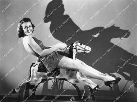 crp-14765 1938 Kay Griffith rides rocking horse stretches out legs vintage pinup pose crp-14765