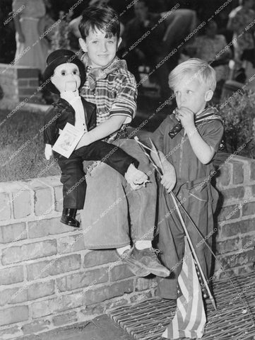 crp-15402 1938 2 kids admire a new Charlie McCarthy ventriloquist doll crp-15402