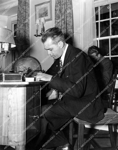 crp-15418 1937 director W.S. Van Dyke at his desk working on film Personal Property crp-15418