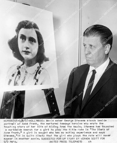 crp-17272 1957 director George Stevens w portrait of Anne Frank crp-17272