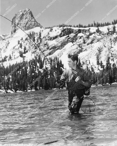 crp-00196 Glenn Ford does some fishing on location in Mammoth Lakes Ca film Gallant Journey crp-00196