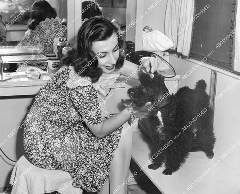 crp-02503 1944 Russian dancer Tamara Toumanova w poodle dog "Bela" in RKO dressing room film Days of Glory crp-02503