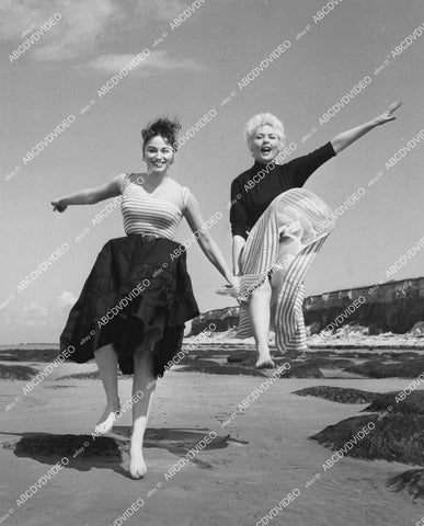 crp-04001 1957 Jackie Collins, Junia Crawford running down the beach film All at Sea crp-04001