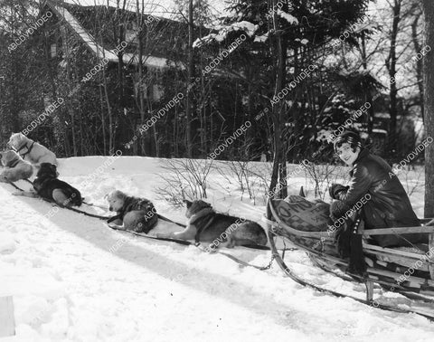 crp-04618 1928 Sally Phipps manning the dog sled silent film News Parade crp-04618