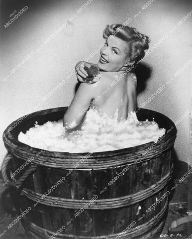 crp-00475 1953 Cleo Moore taking a bubble bath in a barrell bathtub crp-00475