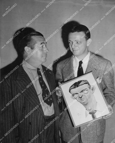 crp-05087 1942 Don Barclay gives Alexander Hall a caricature portrait on set film My Sister Eileen crp-05087