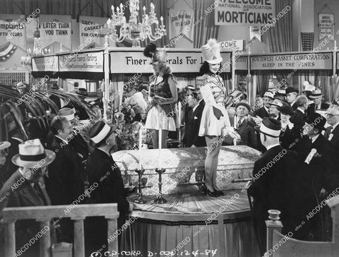 crp-05913 1941 2 babes selling caskets at morticians convention film Three Girls About Town crp-05913