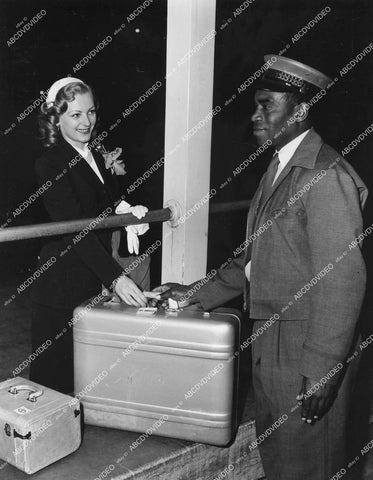 crp-05969 1949 lady arrives at Los Angeles Airport w her baggage crp-05969