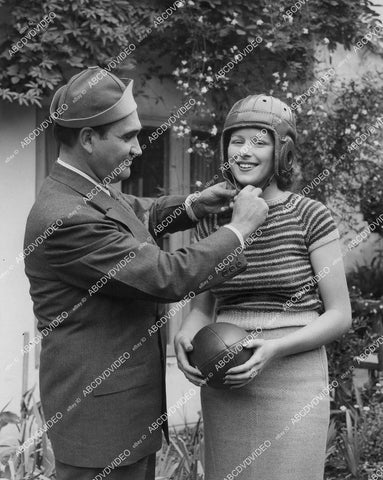 crp-00735 1930s opera star Mario Chamlee helps Mildred Harman USC Co-Ed w leather football helmet crp-00735