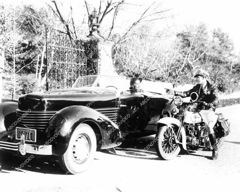 crp-09070 copy photo woman in vintage convertible automobile gets ticket motorcycle cop crp-09070
