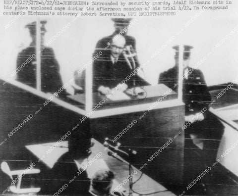 crp-00943 1961 Nazi war criminal Adolf Eichmann man in the glass booth surrounded by security guards crp-00943