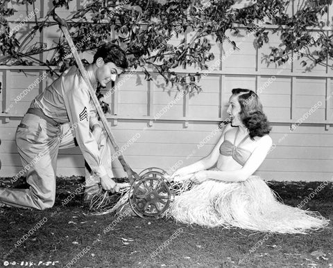 crp-09883 1945 Conrad Janis takes lawnmower to Janis Wilson in her grass skirt film Snafu crp-09883